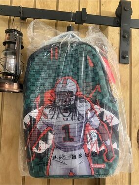 New 🏷️Sprayground Green and Orange Football Player Kids Costume Backpack